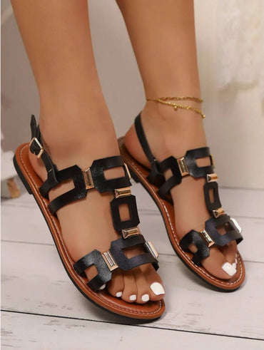 Sandales plates femme noires à détails dorés, tendance 974 Réunion, pédicure blanche