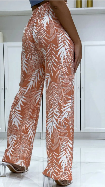 Pantalon femme motif feuilles orange blanc, mode 974 Réunion, tendance tropicale